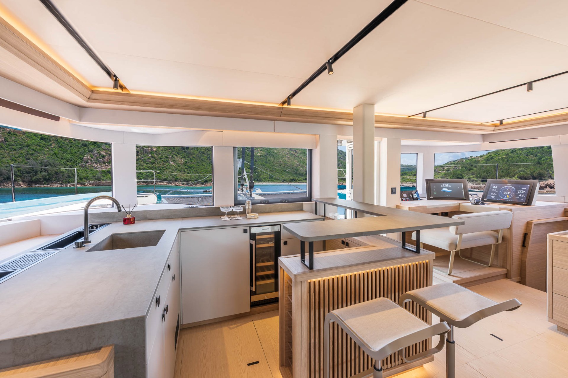 Lagoon Eighty 2 interior command station with navigation displays and galley